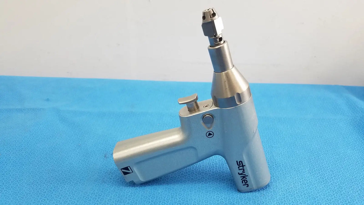 Silver-colored surgical drill handpiece with ergonomic design by stryker for reuse medical and orthopedic instruments use