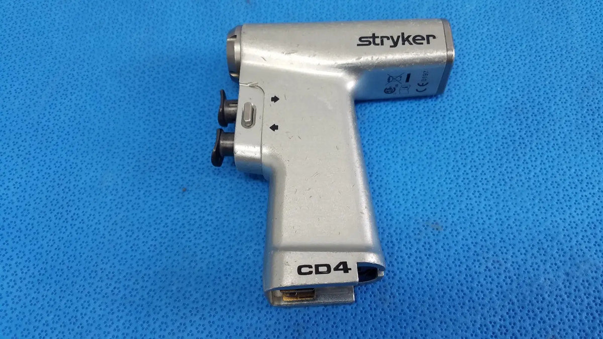 Silver stryker cd4 cordless driver universal handpiece with black knobs and textured grip dual trigger surgical tool