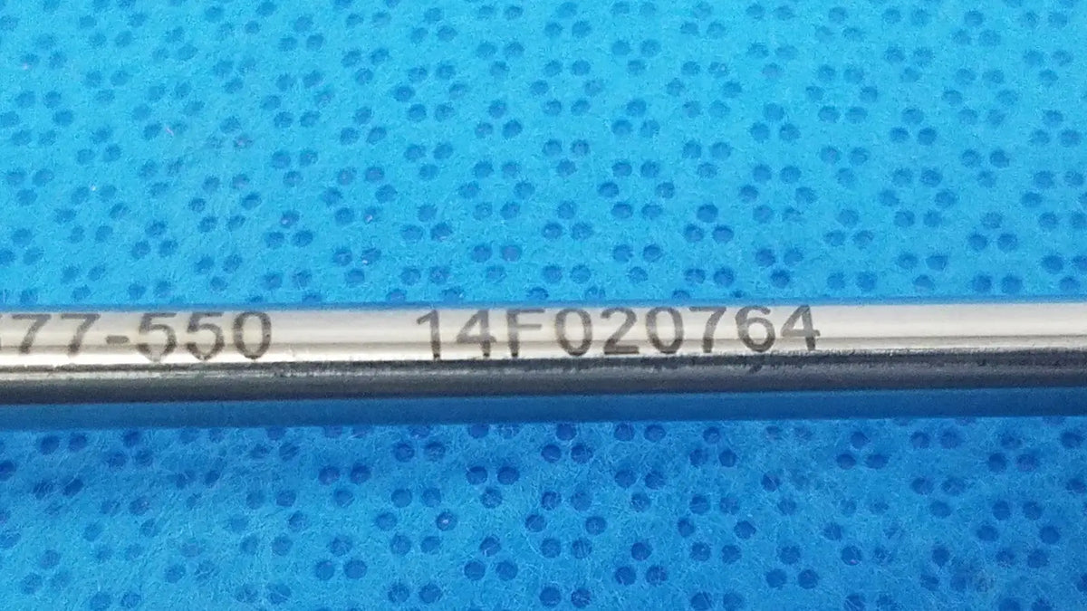Metallic cylindrical rod with serial numbers 77-550 and 14f020764 of stryker endoscopy 58mm surgical trocar