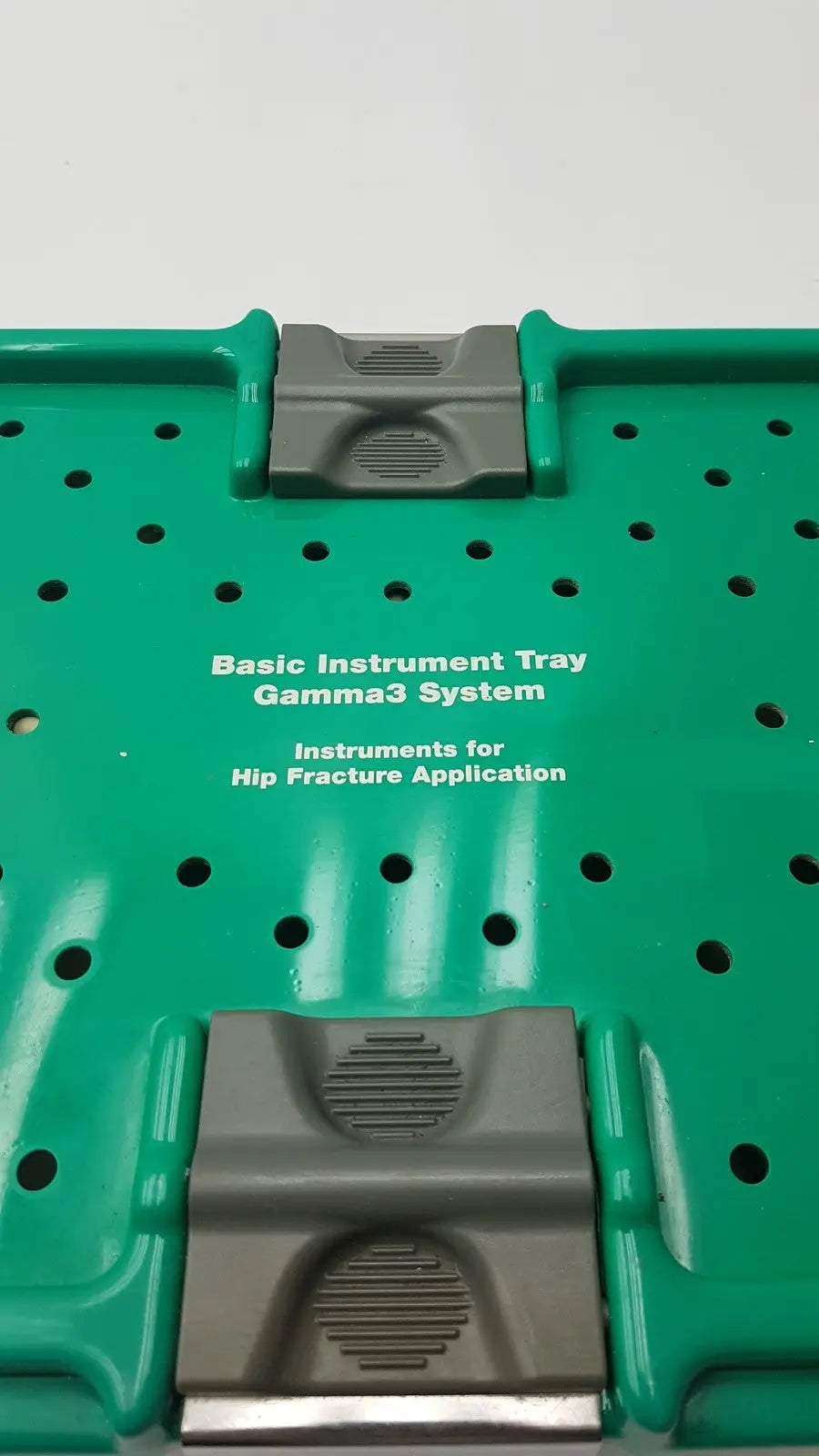 Green plastic optional instrument set tray with gray clasps for stryker gamma3 system hip fracture application