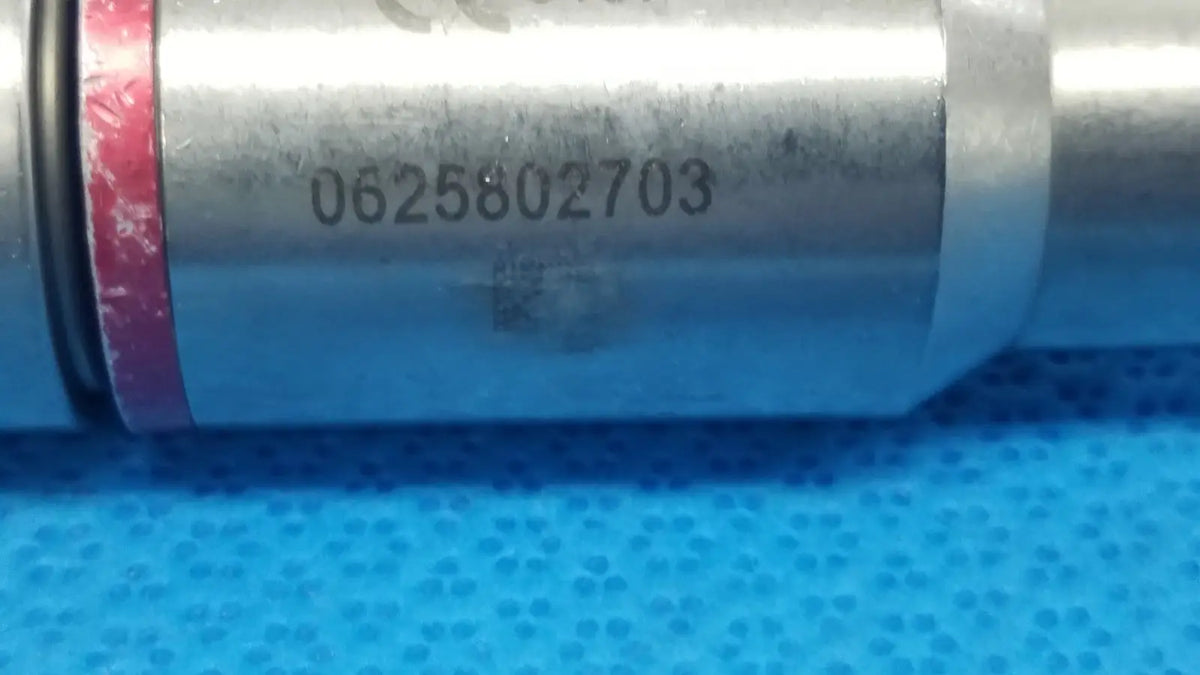 Silver cylindrical 1/4 reamer with engraved serial number and red rubber seal for reuse medical by stryker instruments