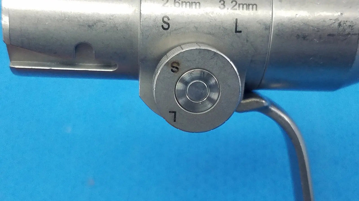 Silver metallic stryker instruments pin collet 4103-126 with engraved size markings and circular dial indicators s and l