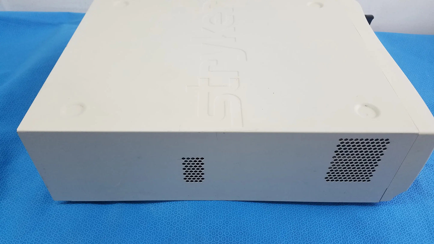 Cream-colored playstation 2 console with matte plastic finish and ventilation grilles used with aim advanced imaging modality