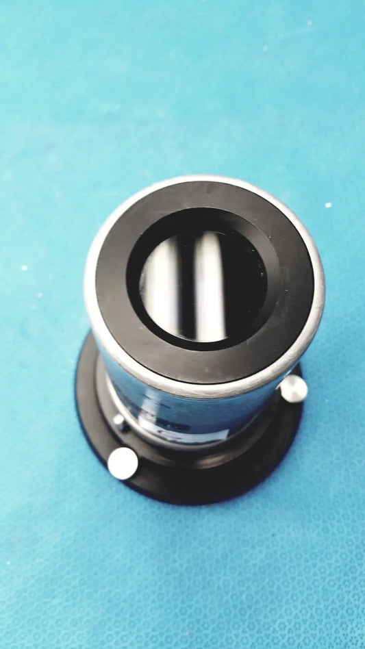 Black and silver cylindrical stryker strykecam 2 in- light camera with reflective interior for medical imaging