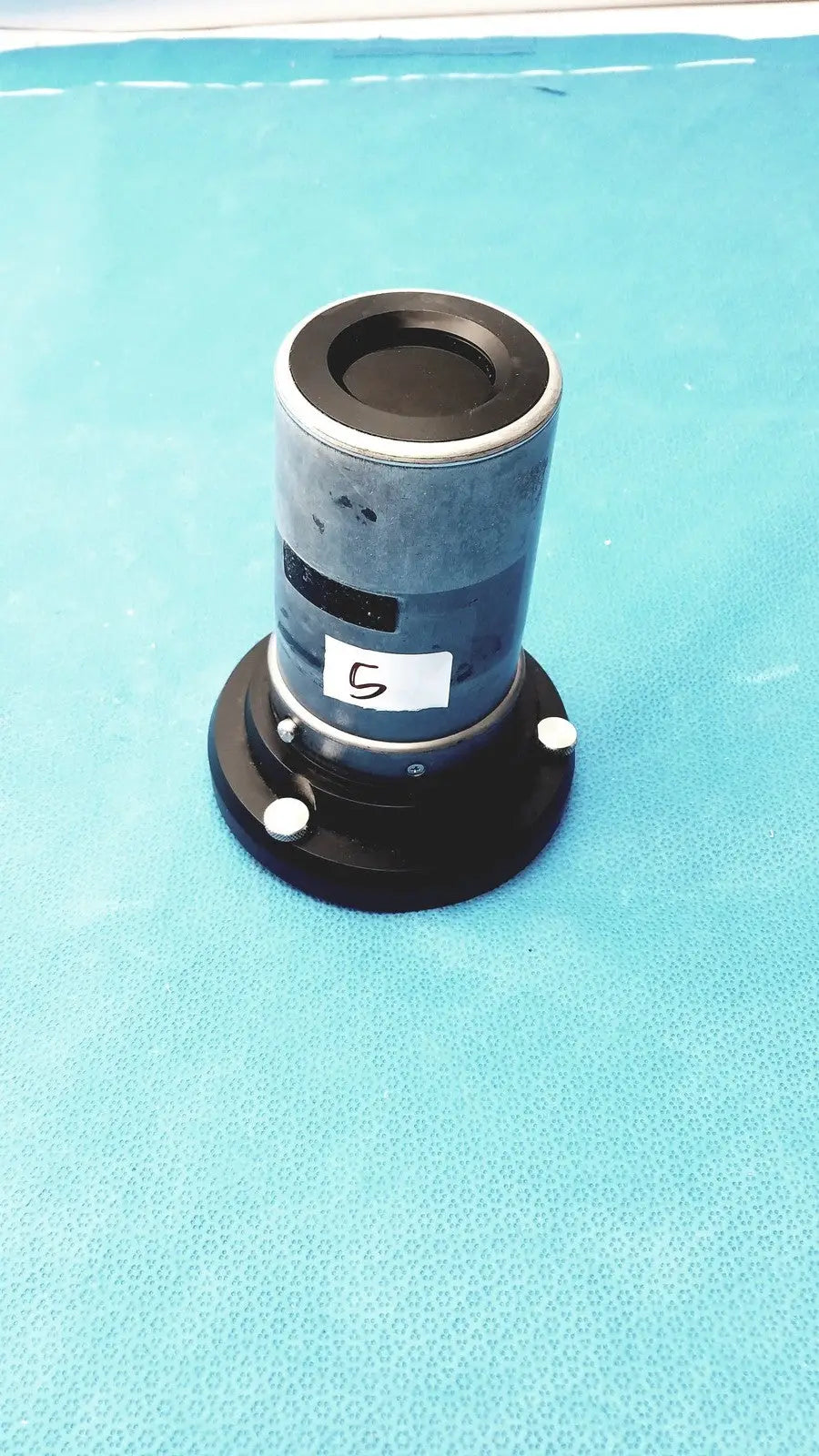Blue cylindrical optical stryker strykecam in- light camera with black top and base featuring a white 5 label