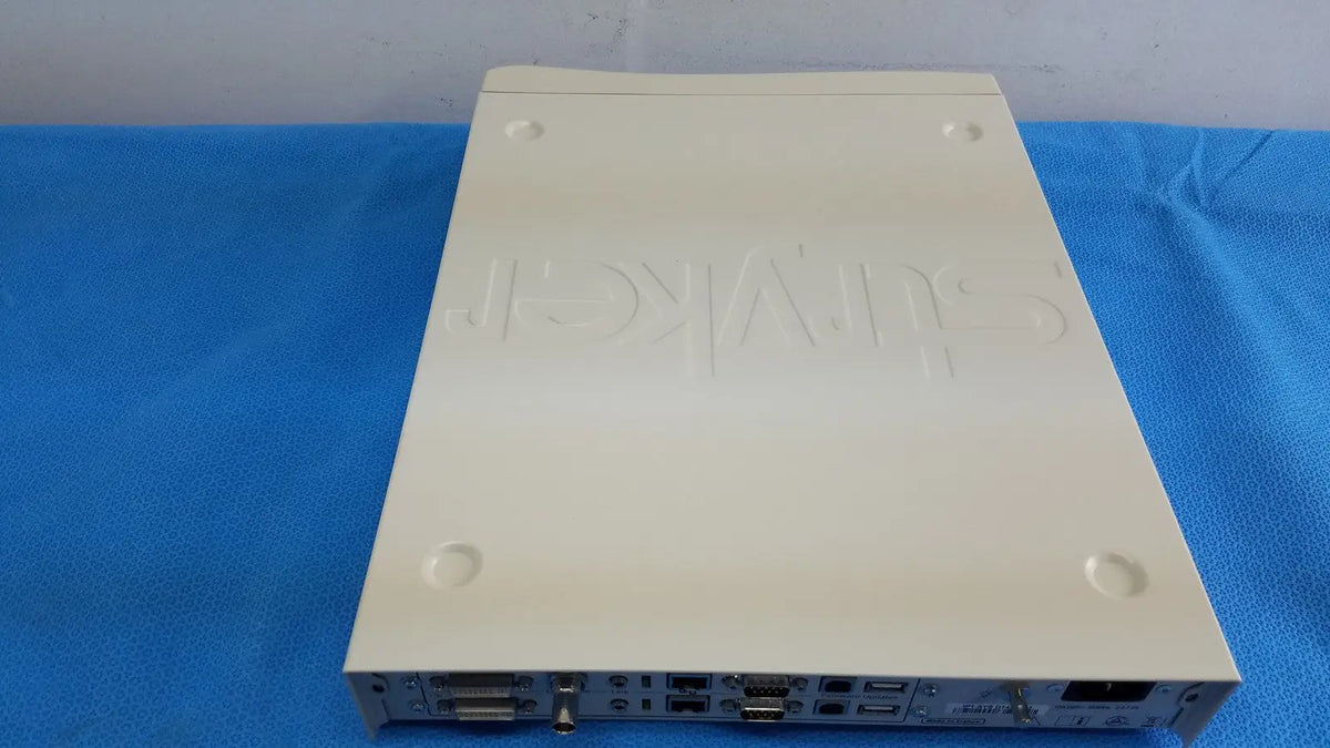 Cream-colored plastic stryker suite stream hd codec with embossed hikvision logo and multiple ports on rear panel