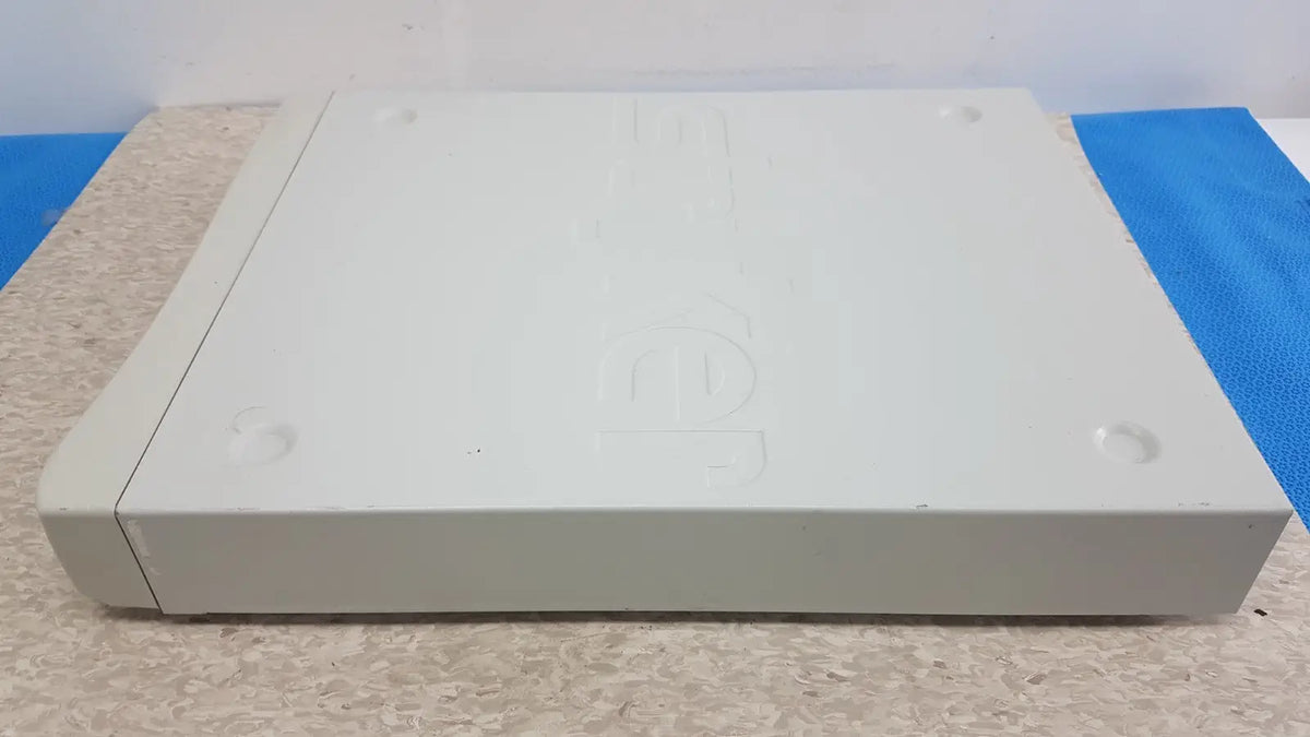 White plastic sony playstation 1 console with embossed logo and rounded edges shown in stryker suitestream hd medical video integration system