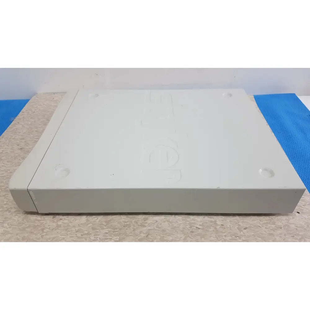 White plastic sony playstation 1 console with embossed logo and rounded edges shown in stryker suitestream hd medical video integration system