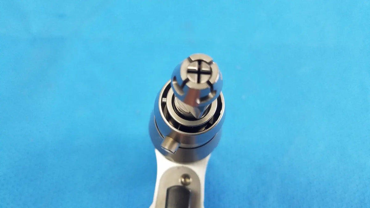 Silver-colored Stryker System 8 sternum saw drill bit with cross-shaped drive tip for reuse medical orthopedic instruments