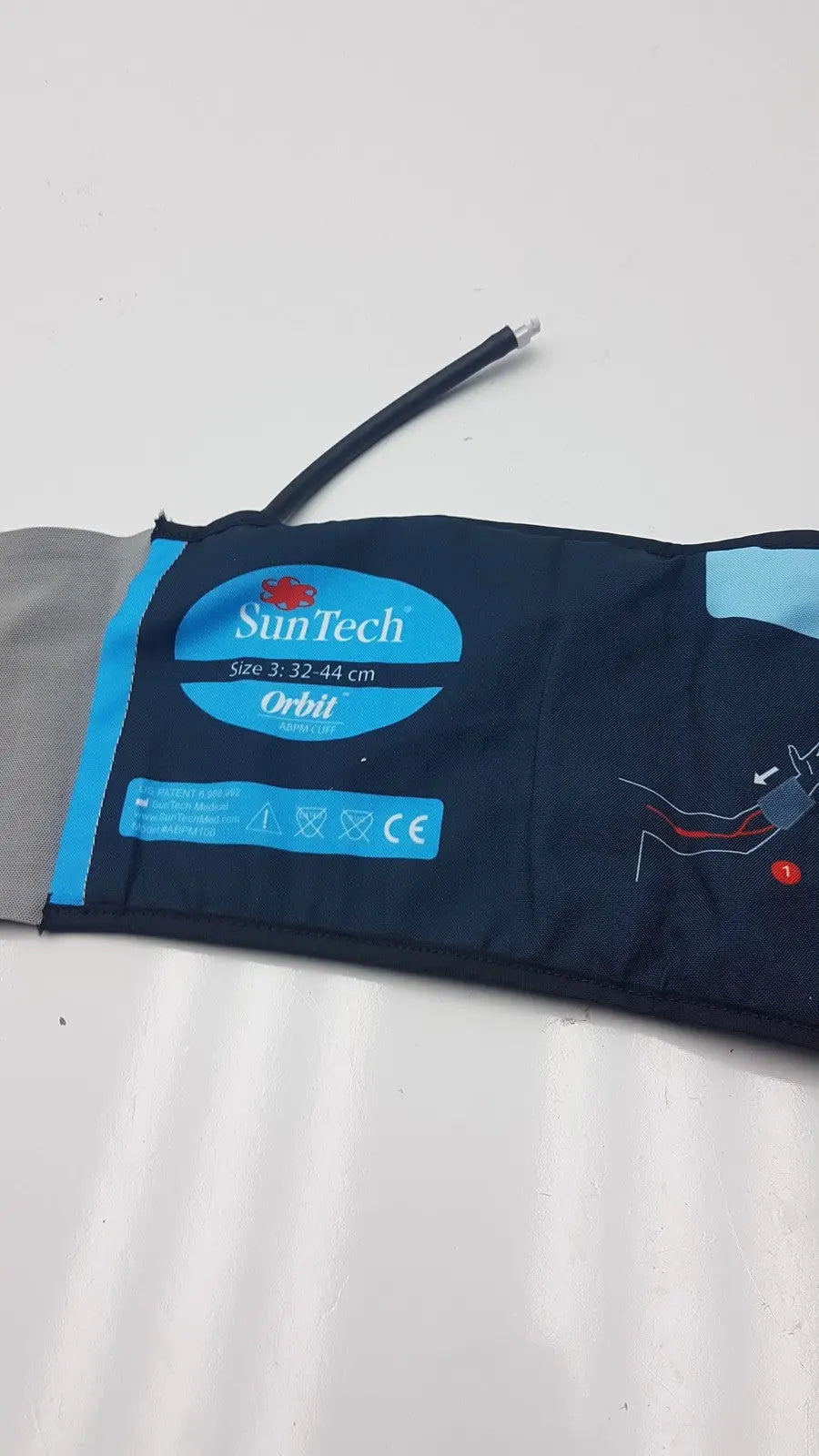 Dark blue suntech orbit abpm cuff size 3 range 32-44 cm with light blue accents and black tube for blood pressure monitoring