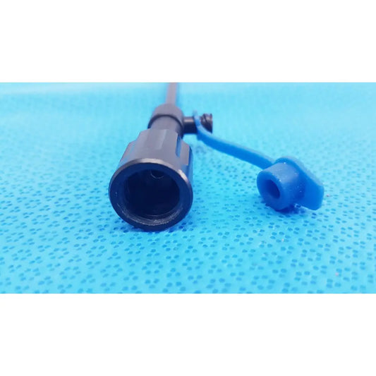 Black plastic surgical cannula sheath with luer lock and distal tip featuring a blue cap and connector