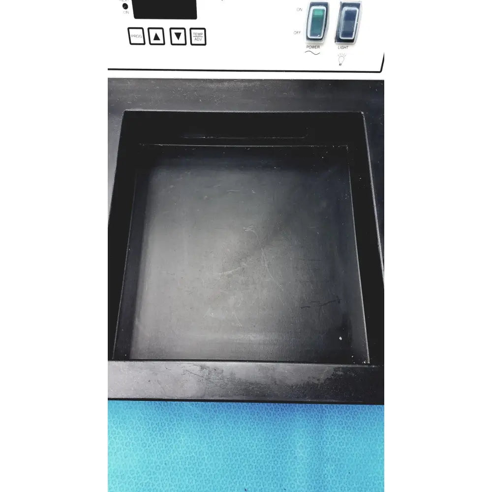 Black rectangular surgipath digital tissue flotation bath with smooth matte finish and raised edges for laboratory use