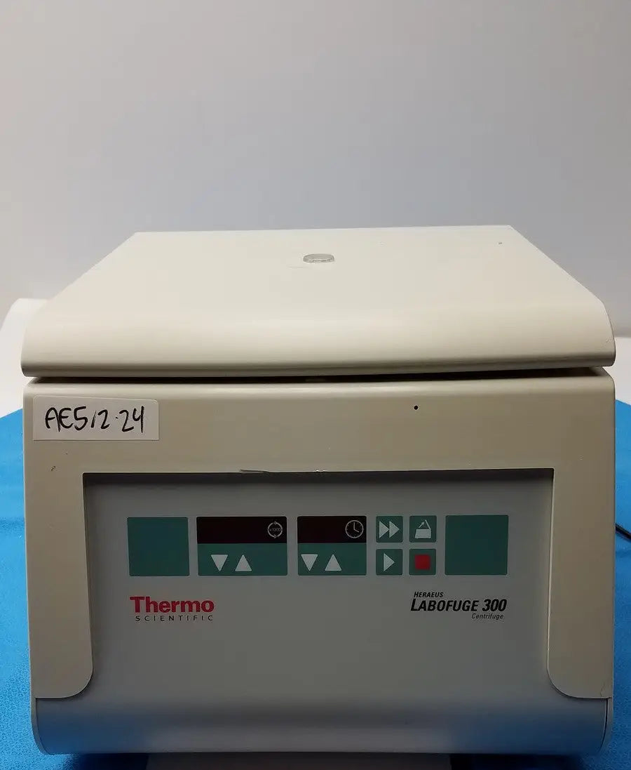 Beige thermo fisher heraeus labofuge 300 laboratory centrifuge with control panel featuring teal and black buttons