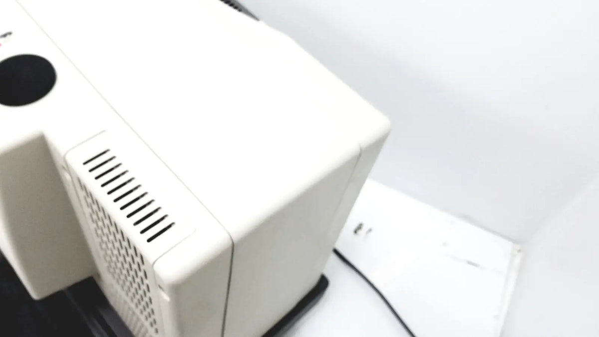 White rectangular thermo nicolet continuum infrared microscope case with black circular vent and slotted side grille