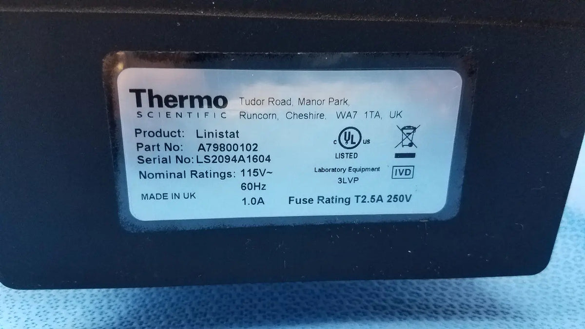 Black thermo scientific linistat linear slide stainer with white label showing product details and certification marks