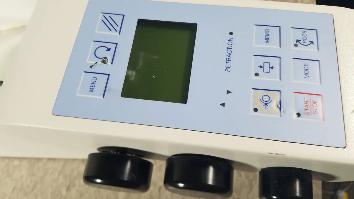 Light blue control panel with black buttons and green screen on thermo scientific microm hm 355 s rotary microtome