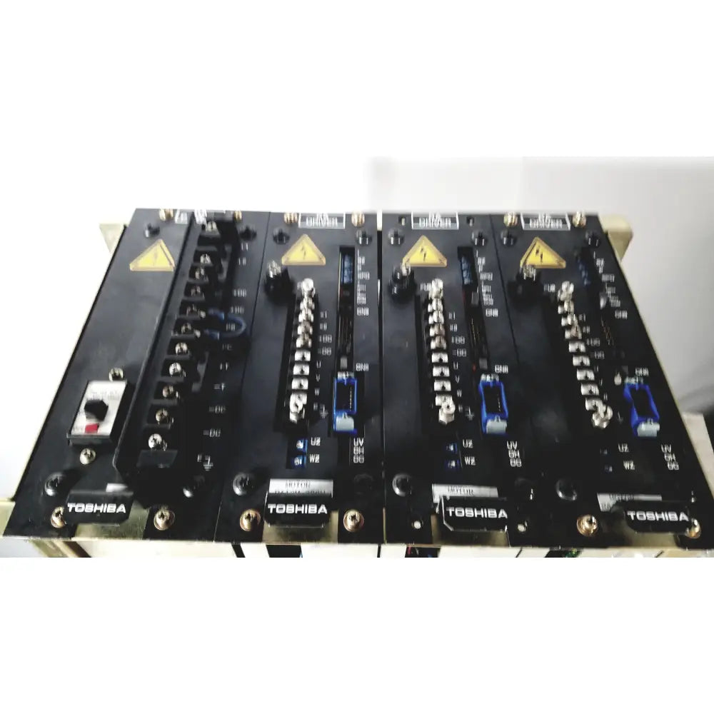 Black Toshiba RA power RAD92-1008 industrial control panels with silver connectors and blue terminal blocks for power supply