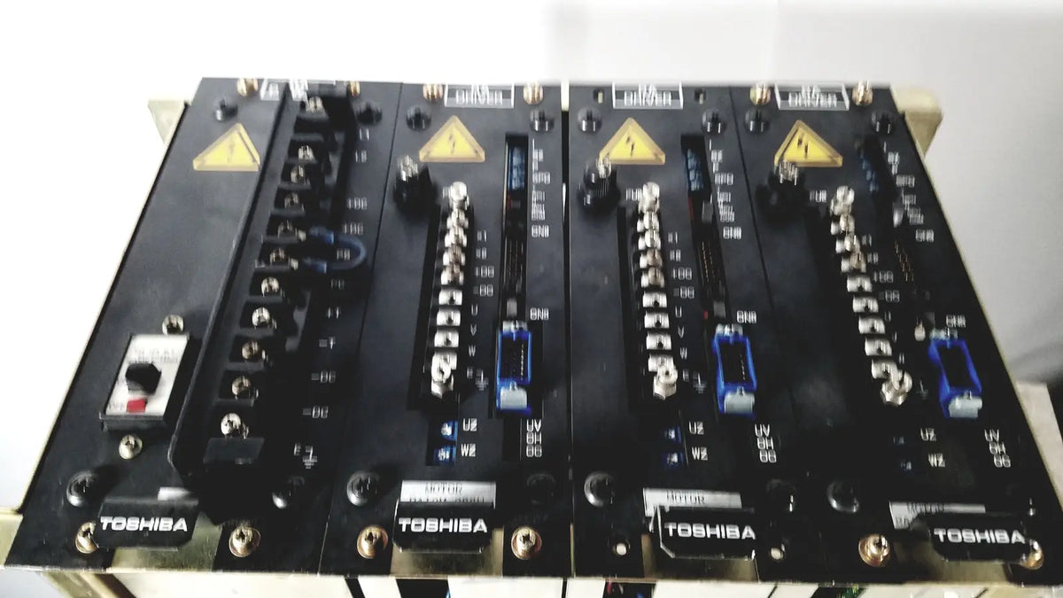 Black Toshiba RA power RAD92-1008 industrial control panels with silver connectors and blue terminal blocks for power supply