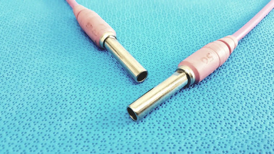 Trompeter pink video patch cord with pink matte plastic housing and metallic 75 ohm coax cable connectors for broadcast use