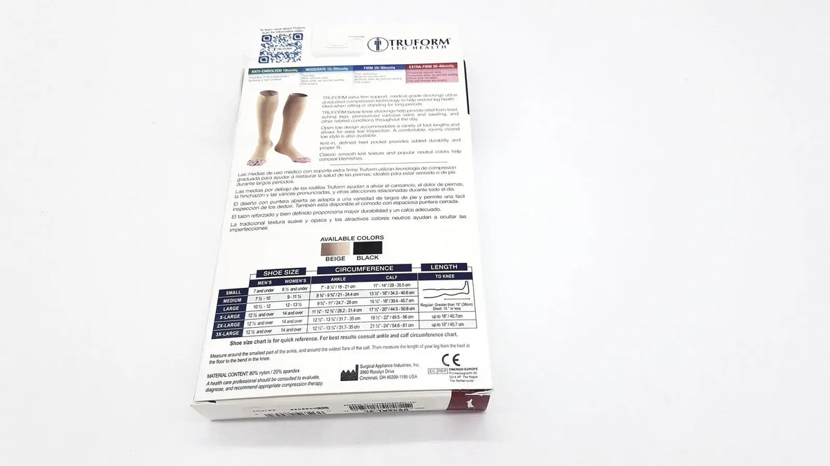 White cardboard shoe box with black and gray text showing truform leg health medical compression thigh high stockings black unisex