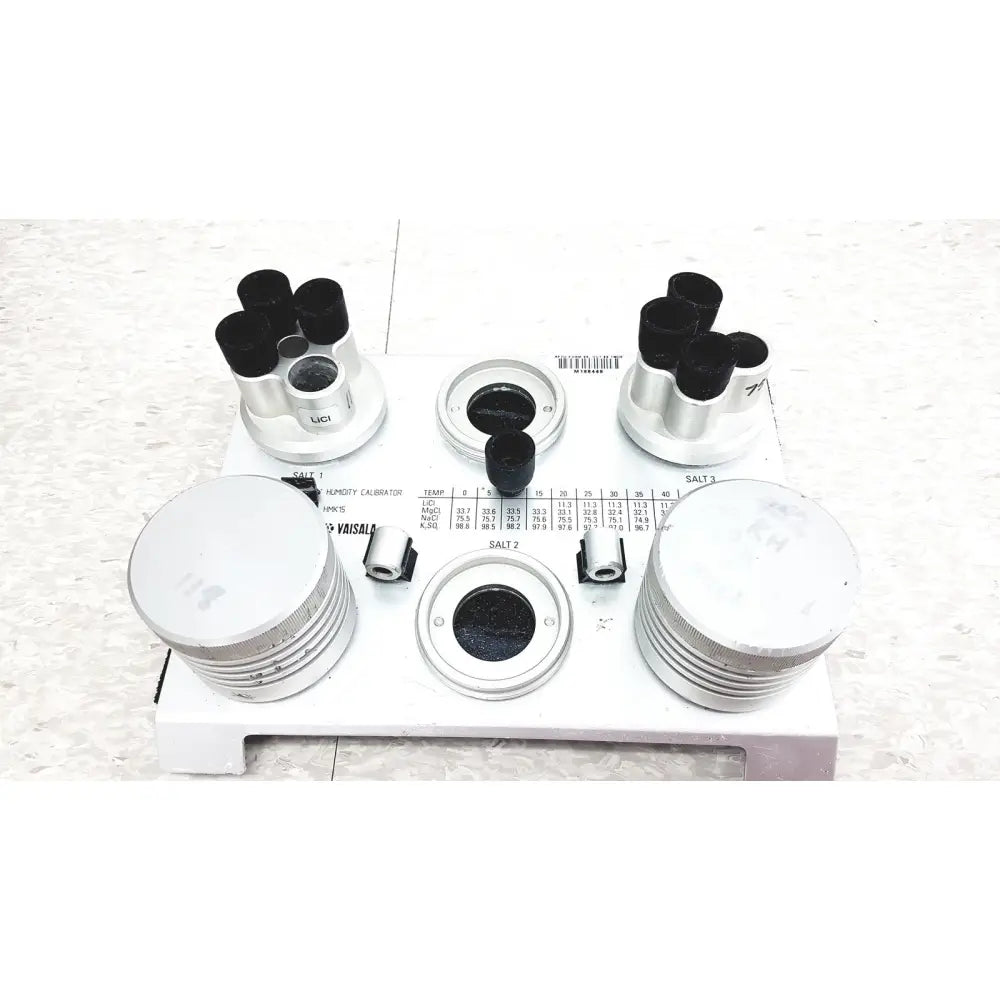 White plastic and metal refractometer with black lenses and labeled parts for vaisala hmk15 humidity calibrator use