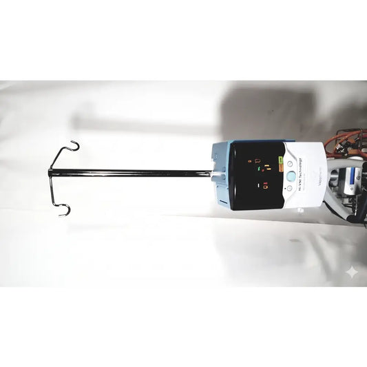 White and light blue medtronic iv pump with black display connected to tubing showing technology precision flow plus features