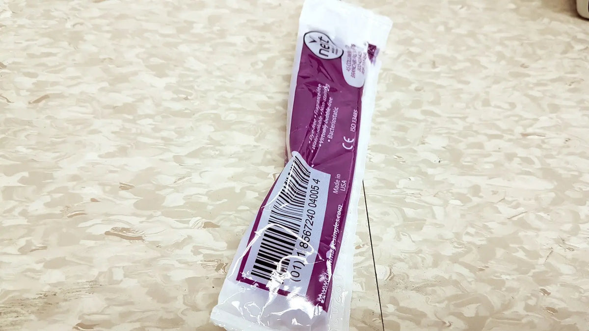 A purple and white packaged verathon bladderscan bvi 6100 handheld bladder scanner medical device