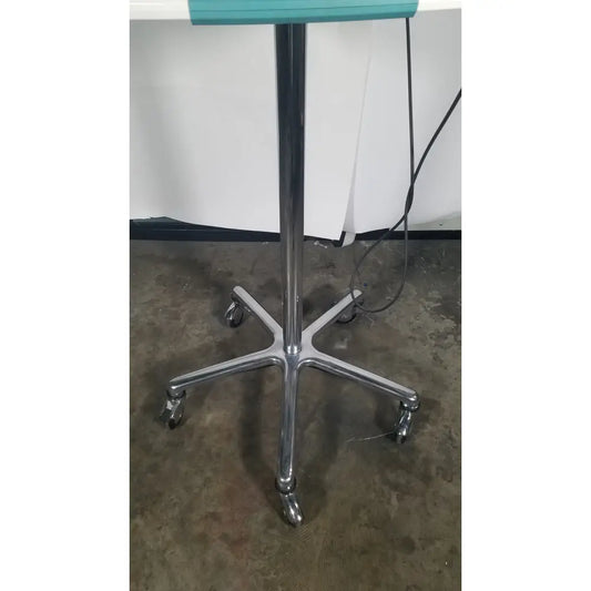 Verathon bladderscan stand with chrome-finished five-legged rolling base and teal top surface for reuse medical settings