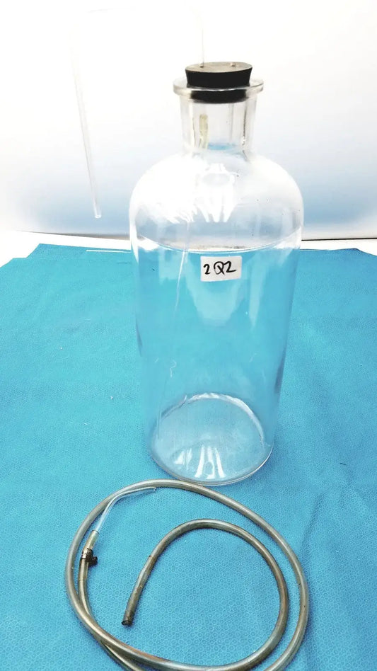 Reuse Medical Vintage 9" Clear Glass Bottle with Embossed Base – Timeless Decorative Piece Jars & Reagent Bottles, second-hand product photo 1