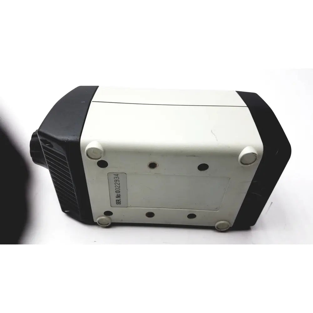 Vision engineering 0022934 microscope camera head in black and white with rounded edges and four circular feet shown from bottom side