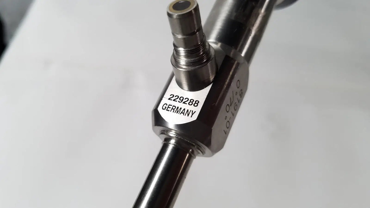 Silver metallic vista stereo precision tool with hexagonal body marked 229288 germany for 70° laparoscopic surgery, has dents
