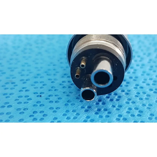 Silver metallic w&h handpiece coupler dental connector with three cylindrical ports and threaded collar for high-speed use