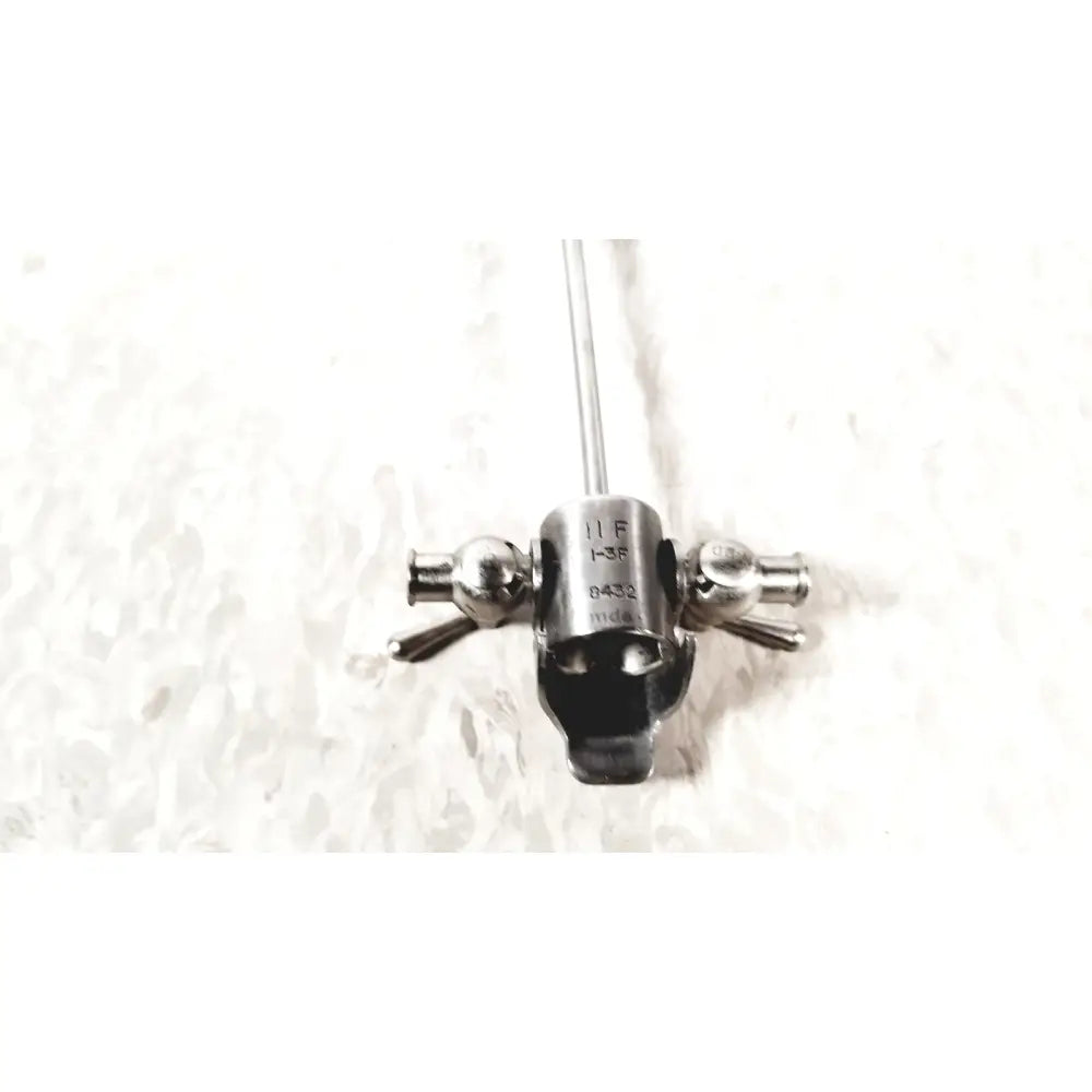 Silver laparoscopic obturator res 11 f with black handle and engraved markings for reuse medical applications