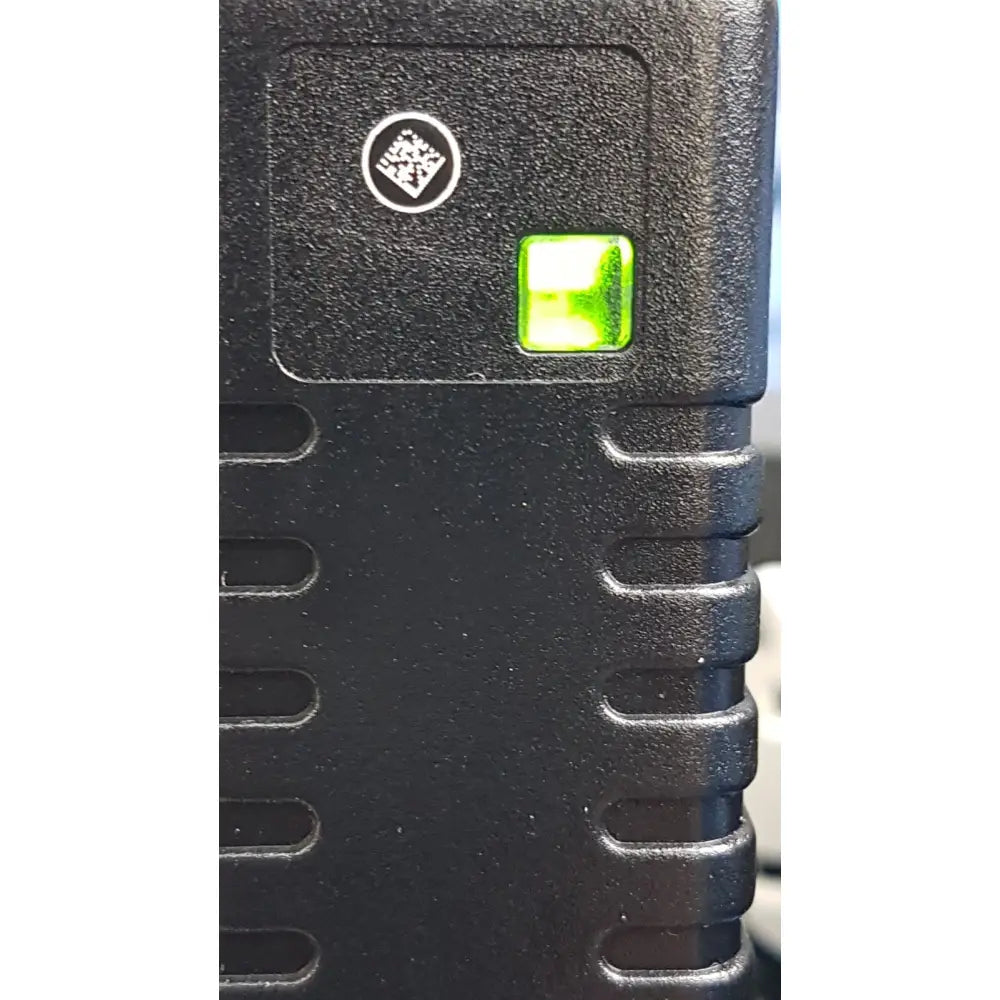 Welch Allyn black textured plastic power adapter plug with glowing green indicator light for medical device use