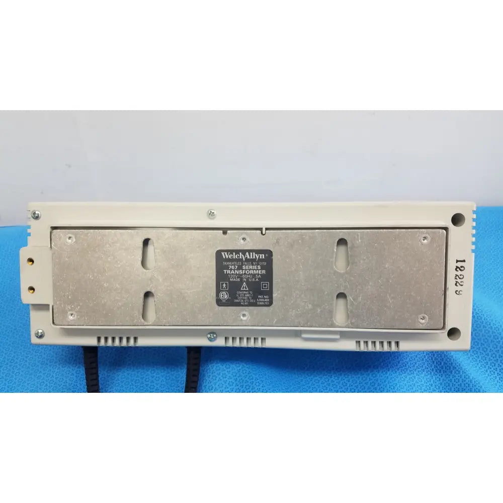 Beige plastic housing with metallic backplate of welch allyn 907 series wall transformer back side for medical use