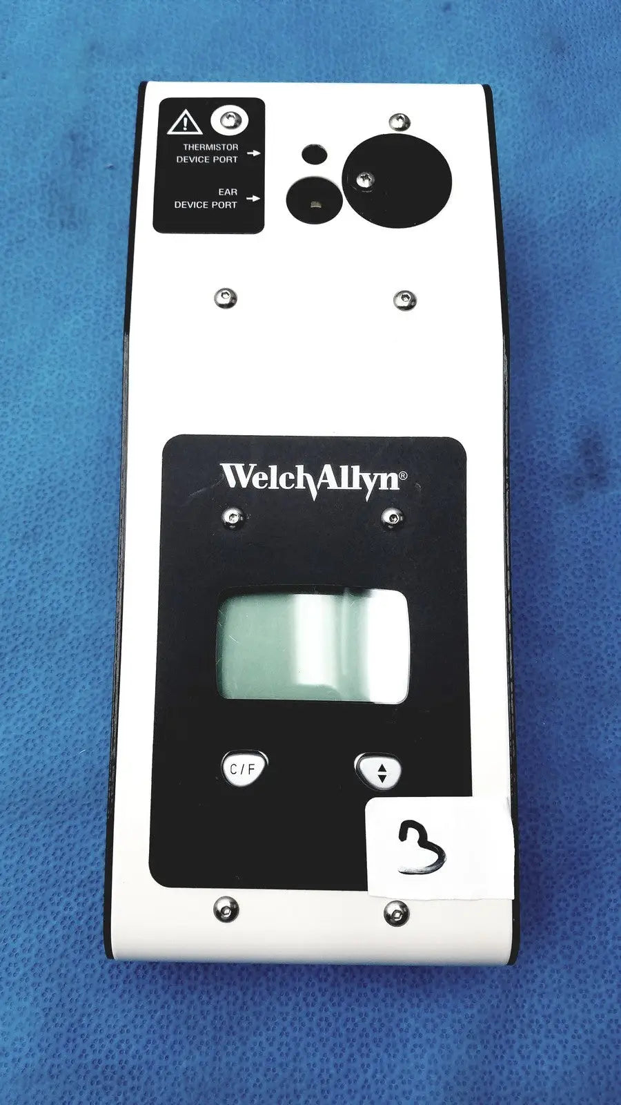 Welch Allyn 9600 Plus calibration tester in white and black with rectangular screen and labeled thermometer ports