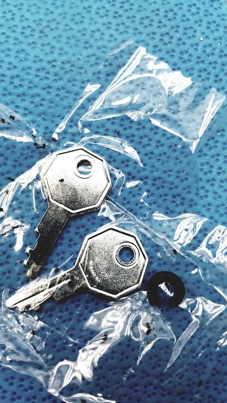 Two silver-toned octagonal-head metal keys in clear packaging for welch allyn 9600 plus calibration tester adapter