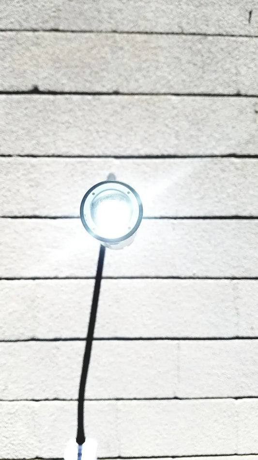 Welch Allyn GS exam light IV circular bright white LED fixture with clear glass cover and black cord for medical use