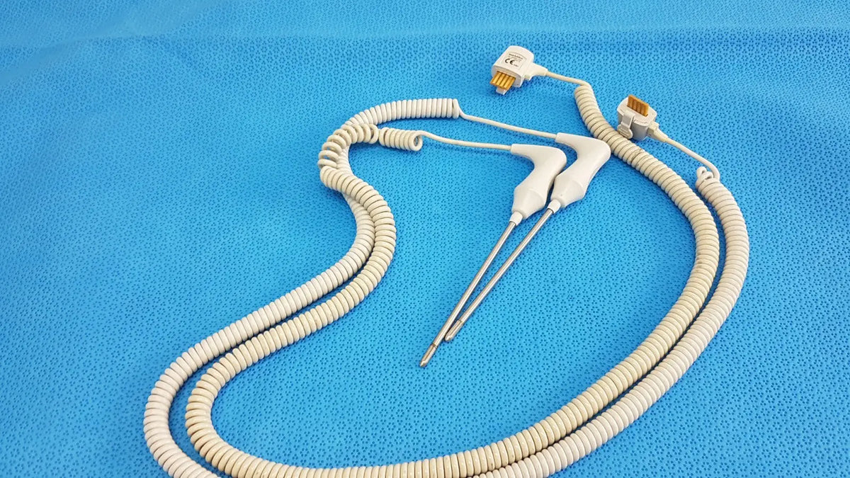 White coiled welch allyn probe with metallic connectors and probes in rectal probe well kit lot of 2