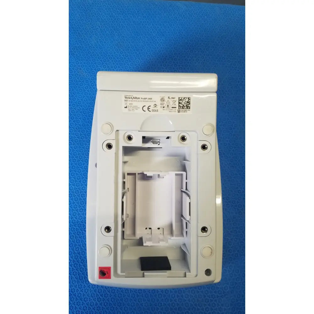 White plastic wall-mounted electrical outlet cover with integrated screws for welch allyn probp digital blood pressure device