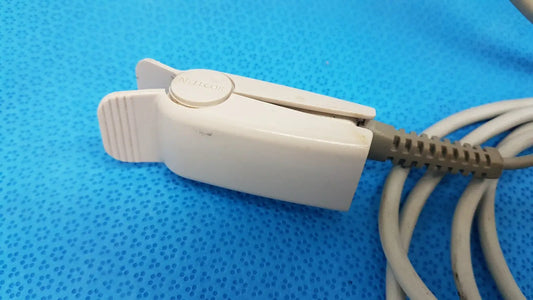 White plastic patient monitor clip with textured grip and nellcor button for welch allyn propaq encore series device