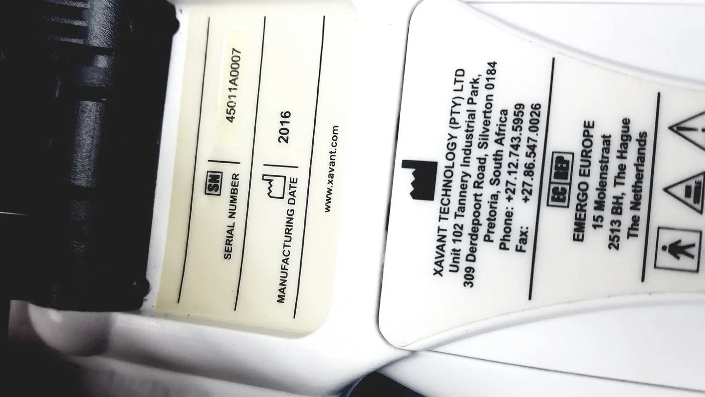 White plastic label with black text showing serial number 45011a0007 and 2016 date on xavant technology stimpod nms monitor