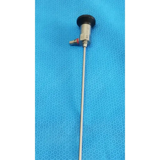 Silver xomed sharpsite autoclavable endoscope with black circular cap and metallic joints for reuse medical applications