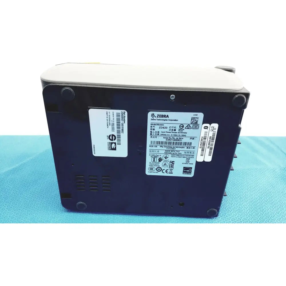 Dark blue zebra zd420 barcode scanner with light gray top and black rubber feet shown with zebra zd620 thermal transfer printer