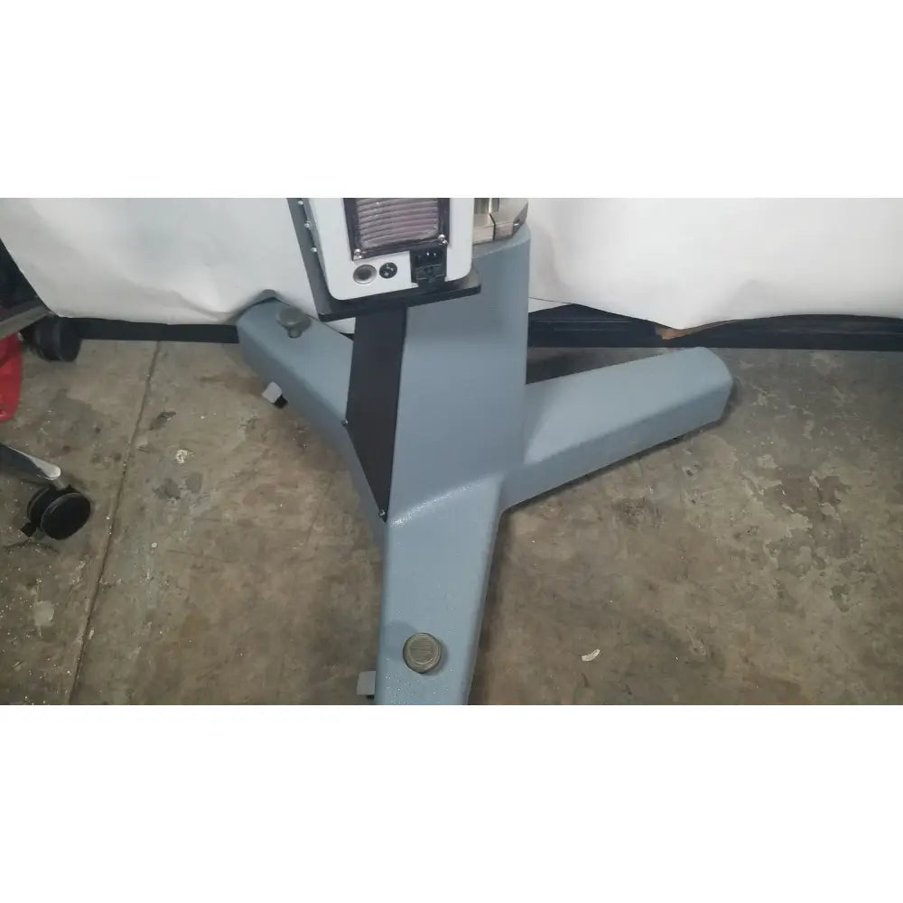 Gray industrial-grade floor stand with black central support and white control panel for zeiss opmi-1 prescott’s mark ii