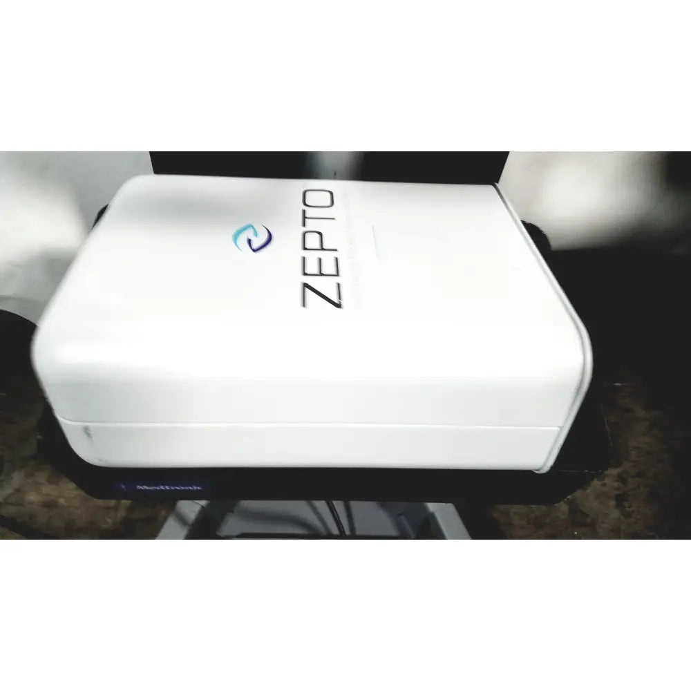 White rectangular zepto precision pulse capsulotomy device with sleek design and blue logo for zepto power console use