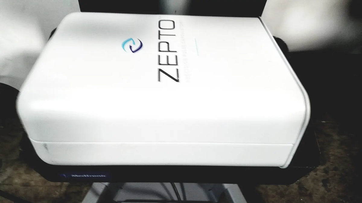 White rectangular zepto precision pulse capsulotomy device with sleek design and blue logo for zepto power console use