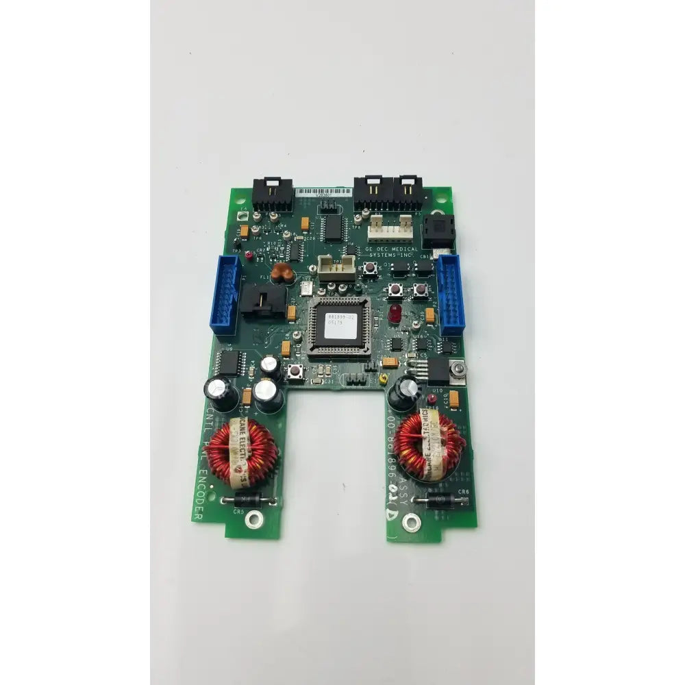 Green control panel encoder board with black connectors red coils and central processor chip for GE 9800 C-Arm system