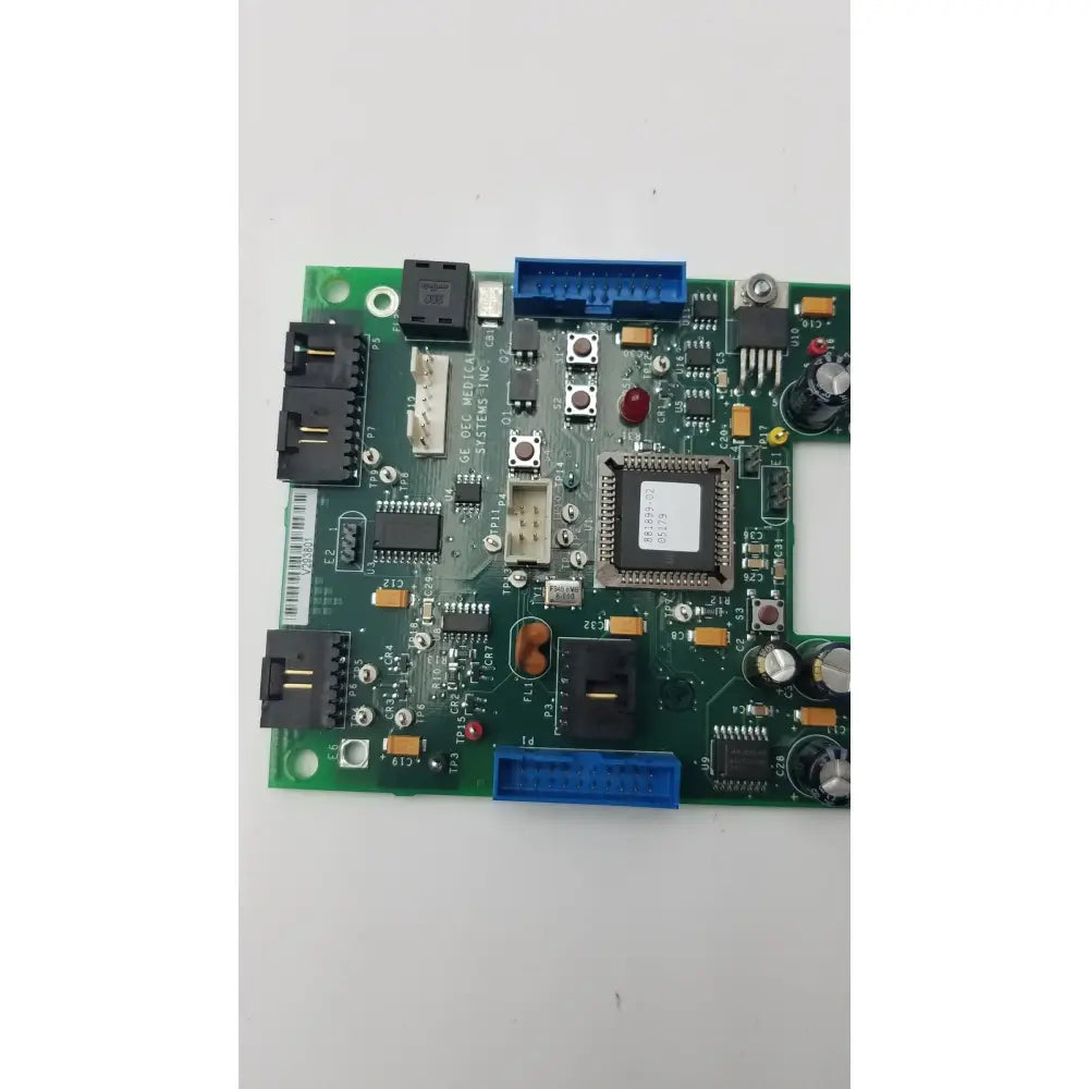 Green control panel encoder board with black and blue connectors and silver chips for GE 9800 c-arm system
