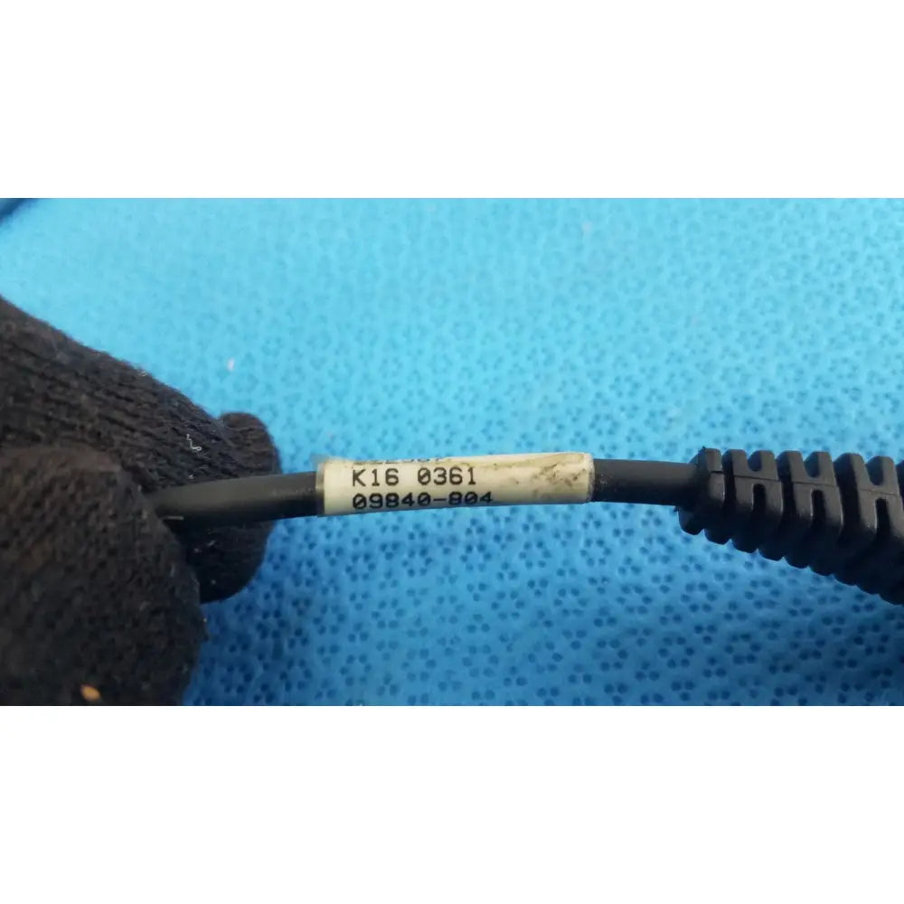 Black coiled cable with white label and rj connector for barcode scanner pen model 09840-804 scanner pen cable